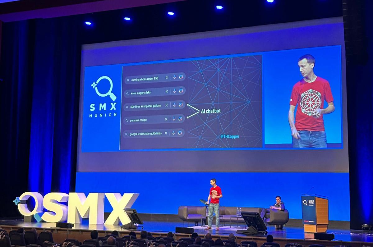 A photo of Tom Capper speaking on stage.